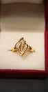Intricate gold ring pattern