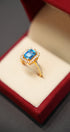 Gold ring with blue stone
