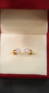 Gold ring with diamonds in a red box