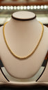 gold necklace close-up product shot