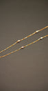 Delicate gold chain necklace with diamond accents