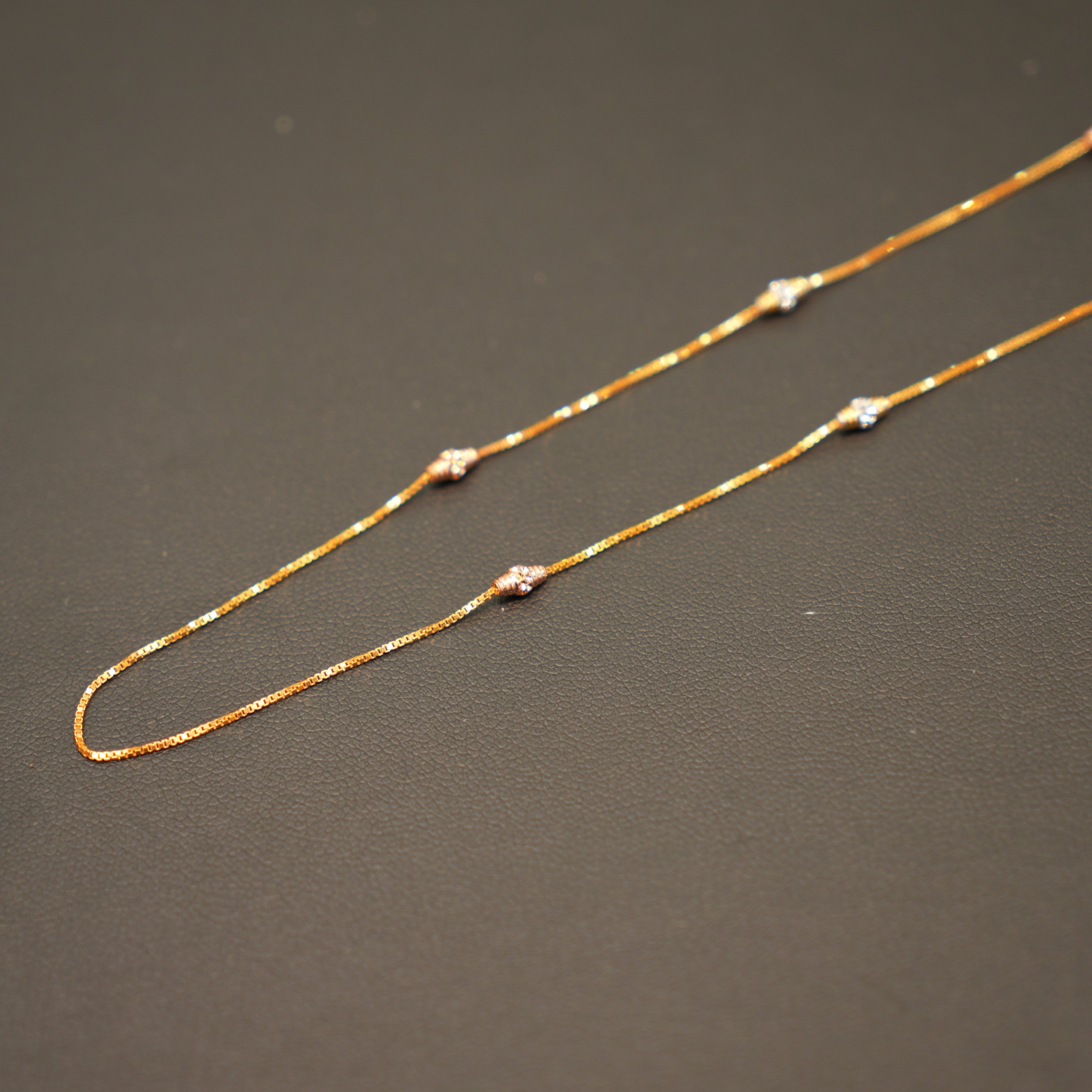 Delicate gold chain necklace with diamond accents