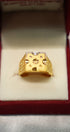 Elegant gold earrings in velvet display box