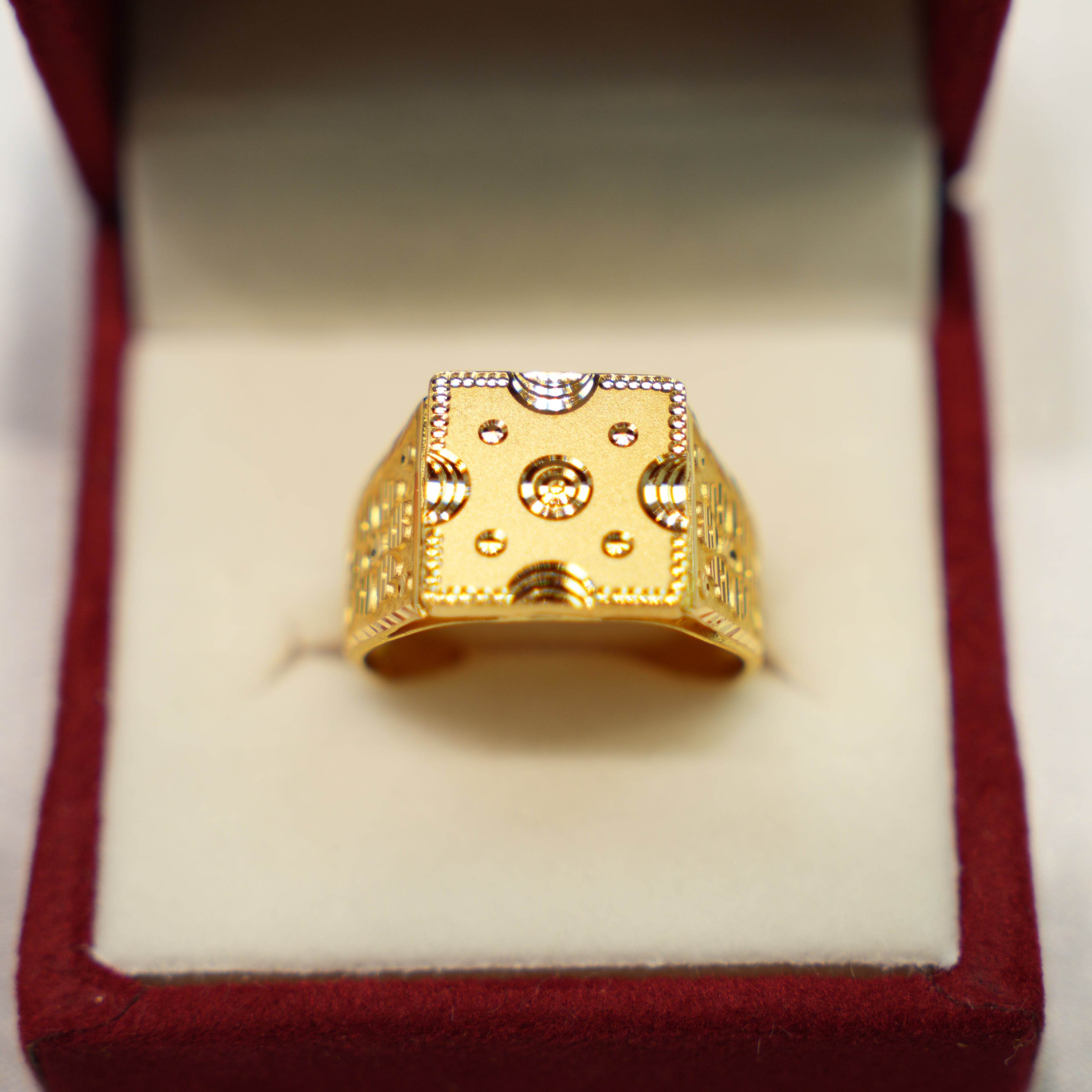 Elegant gold earrings in velvet display box