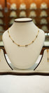Gold necklace with detailed artisan work