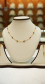 Gold necklace with detailed artisan work