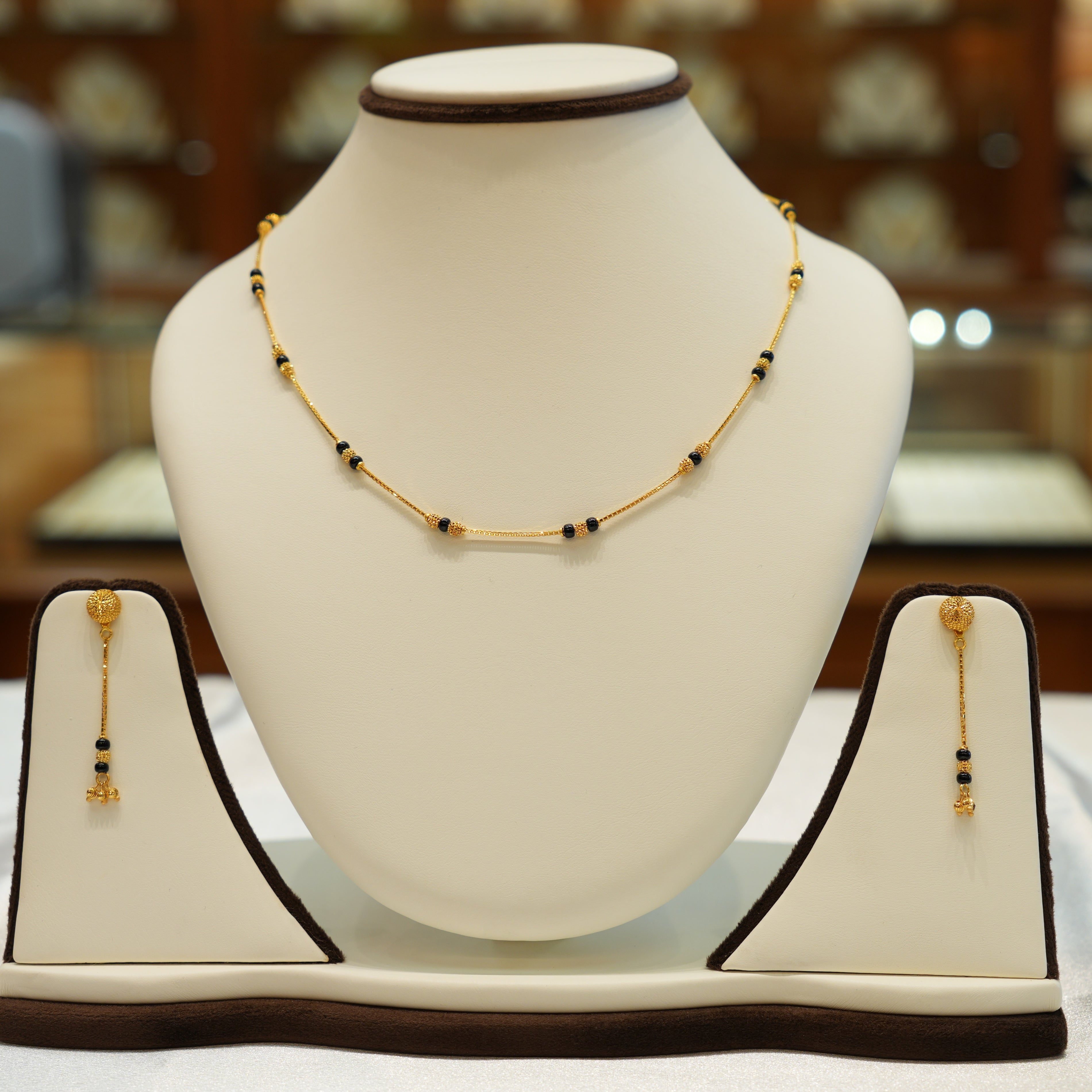 Gold necklace with detailed artisan work