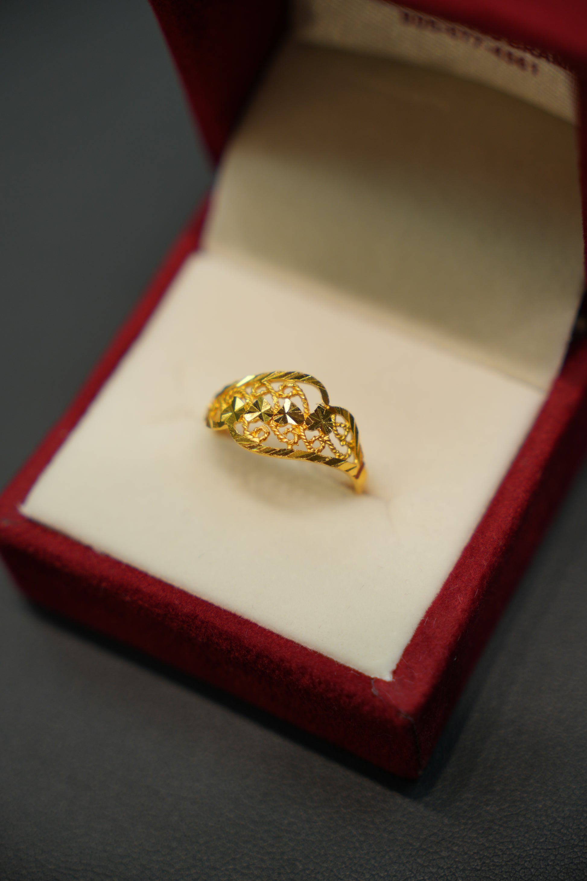 Front view of 22K gold ring with polished detailing