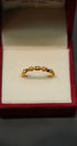 Side profile of elegant 22K gold ring