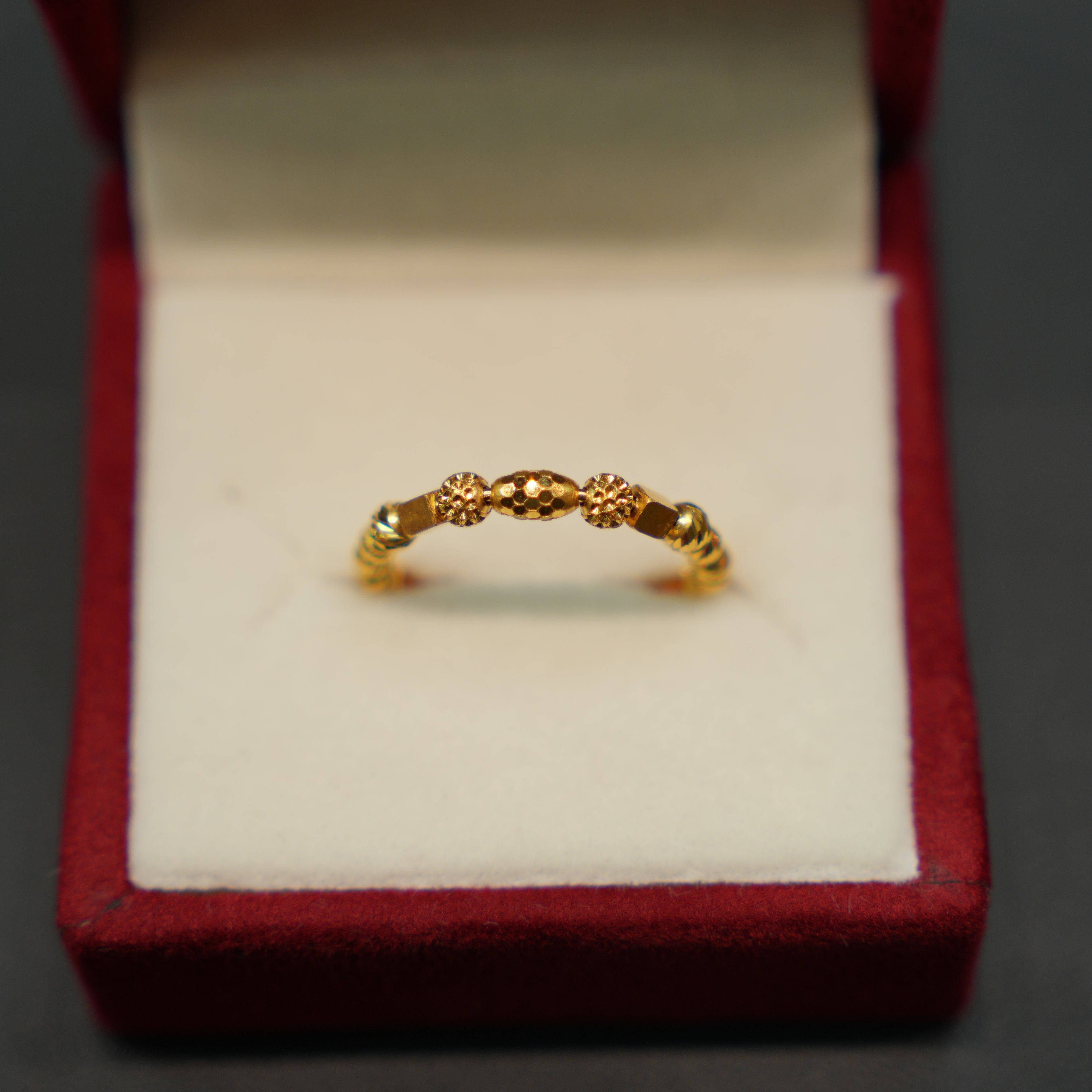 Side profile of elegant 22K gold ring