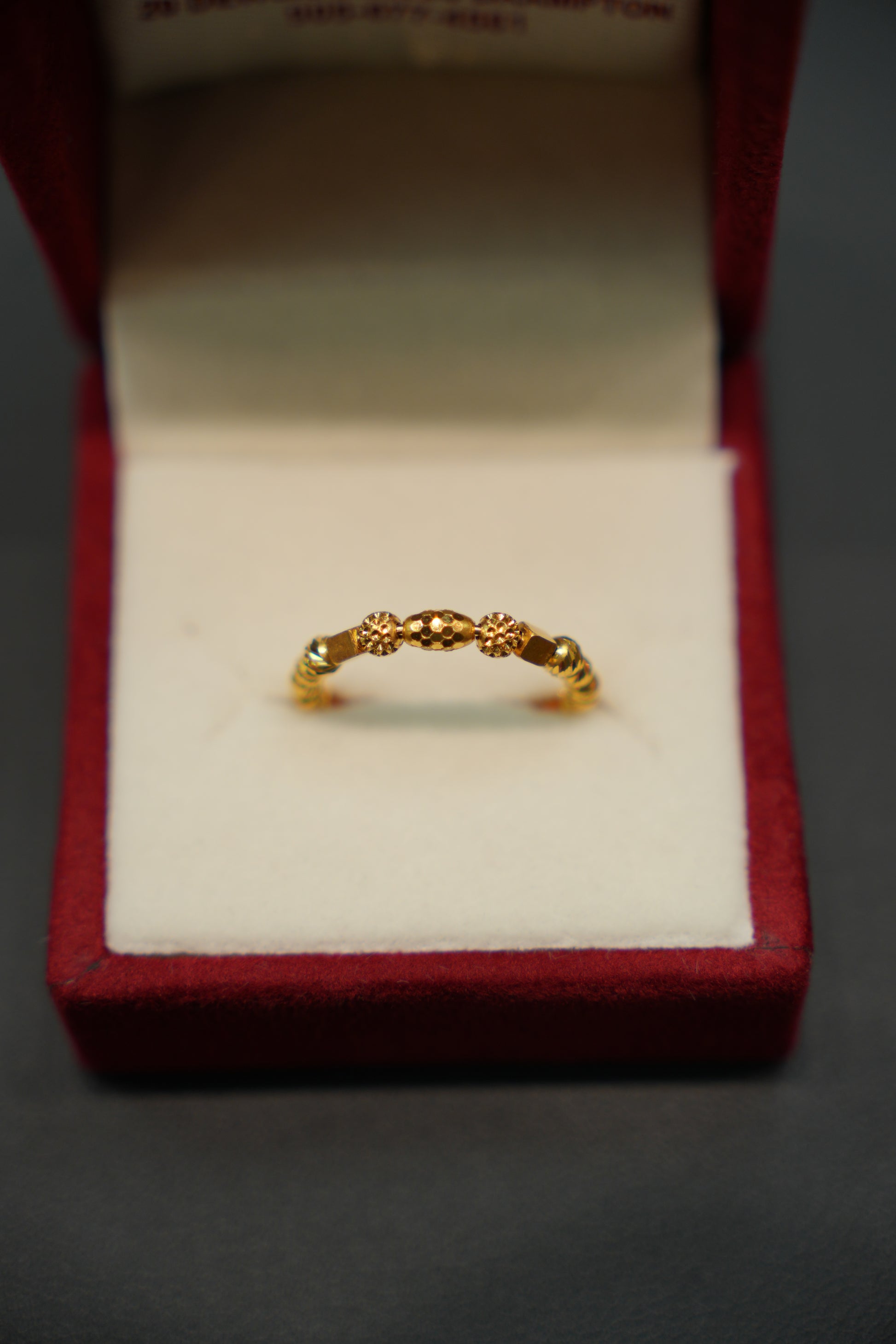 Side profile of elegant 22K gold ring