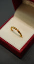 Close-up of handcrafted yellow gold ring design