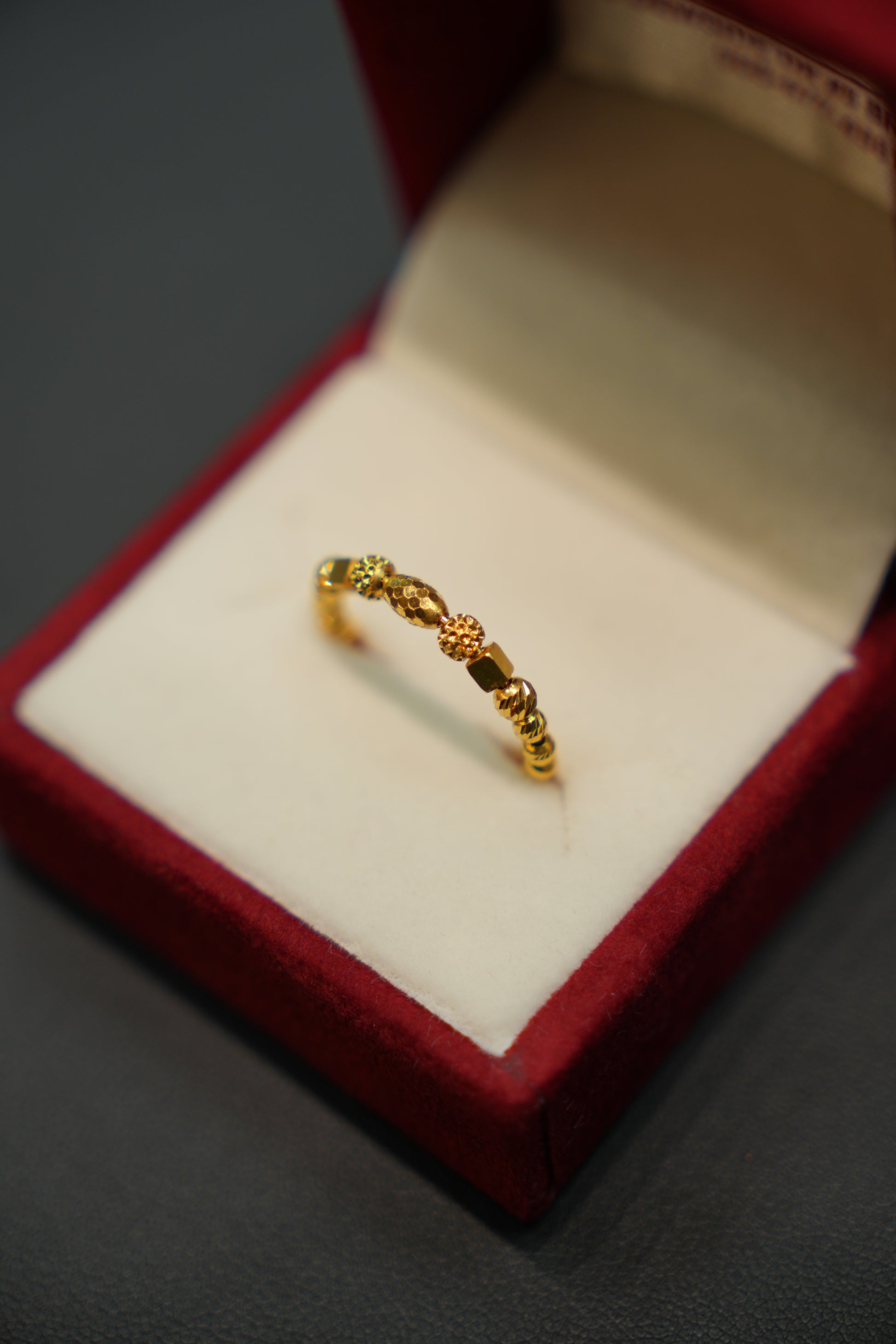 Close-up of handcrafted yellow gold ring design
