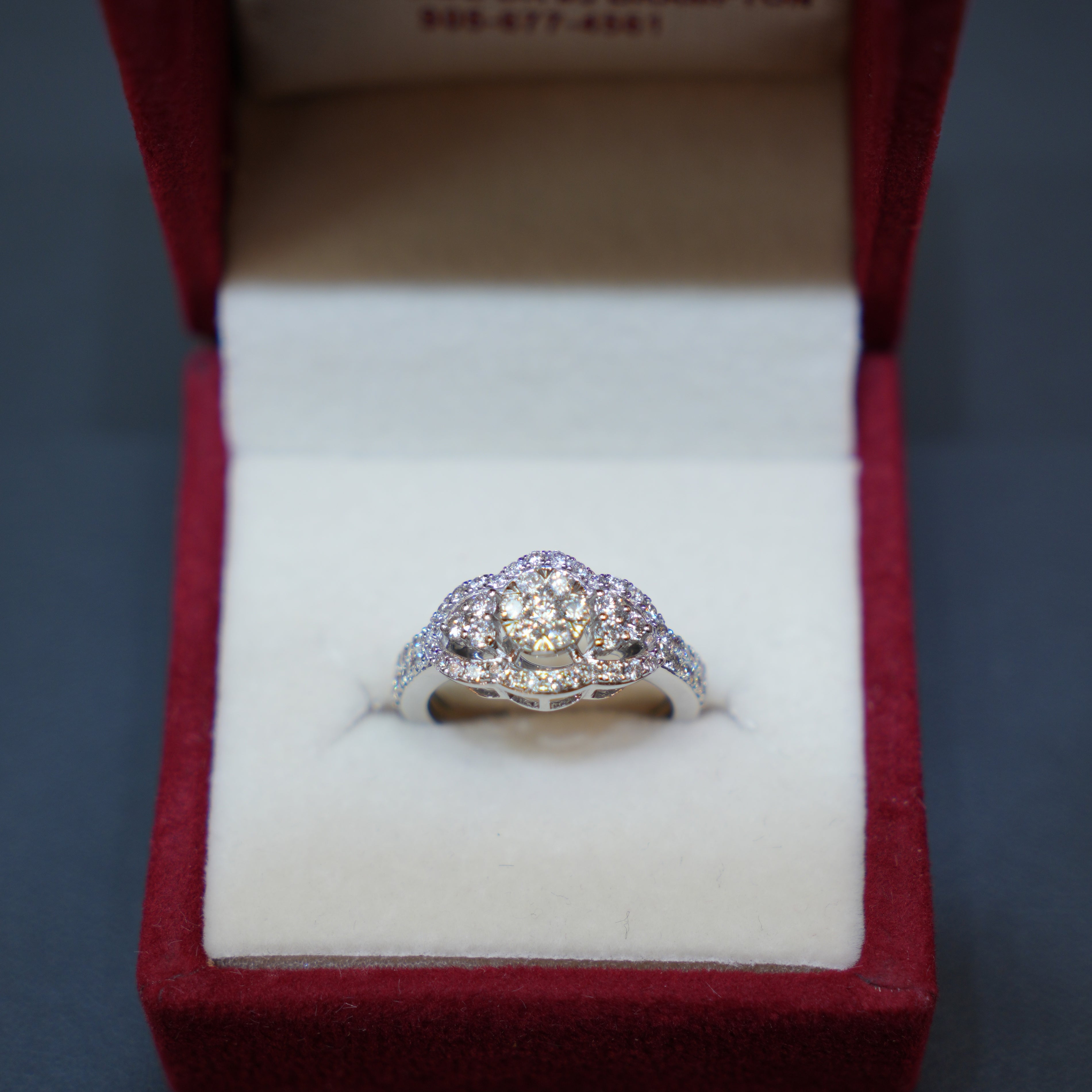 Diamond Rings showcasing a beautifully crafted 14K white gold ring with natural diamonds in floral clusters.
