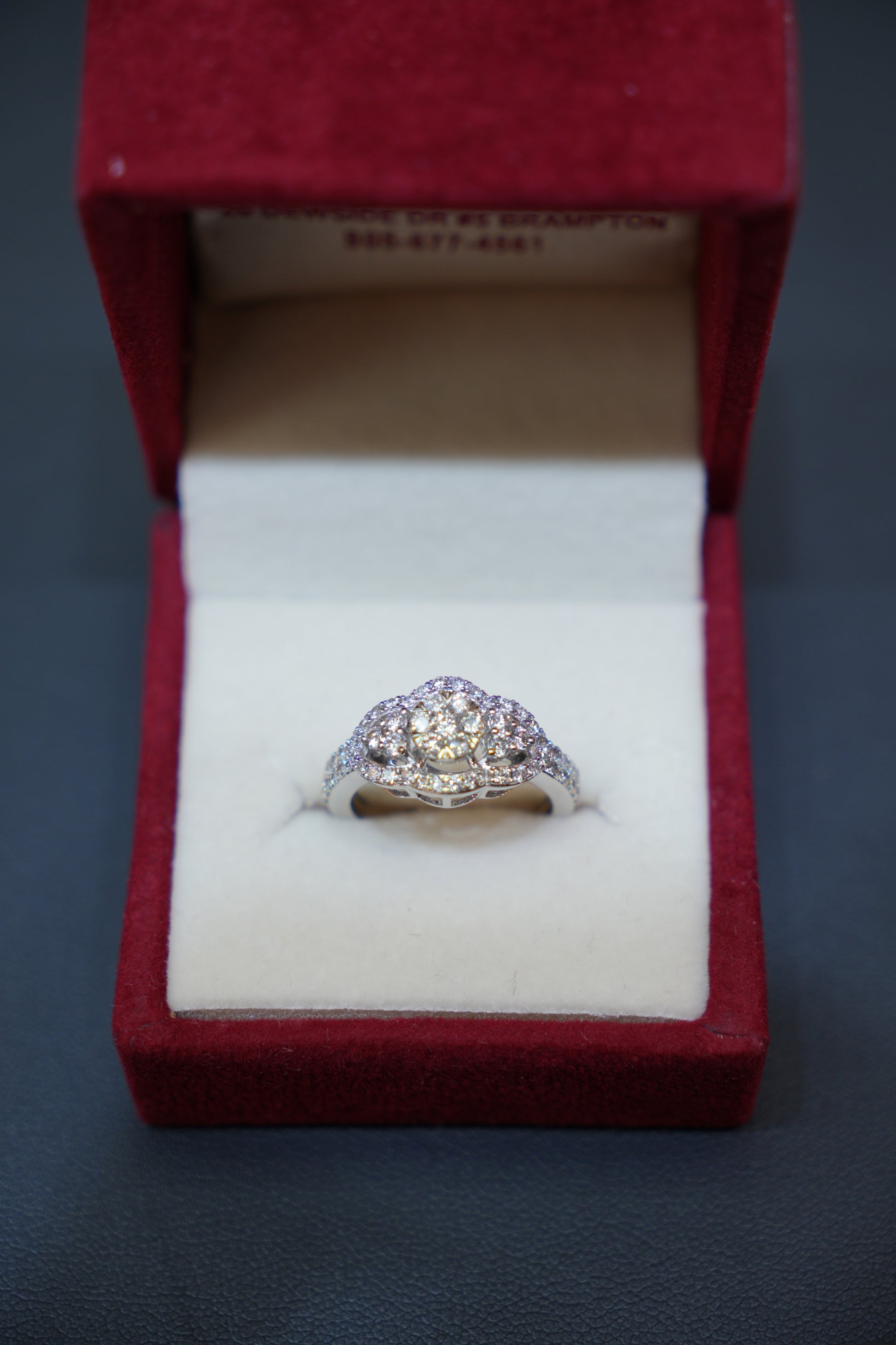 Diamond Rings showcasing a beautifully crafted 14K white gold ring with natural diamonds in floral clusters.