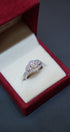 Exquisite diamond ring in 14K white gold displayed in a red velvet ring box. Diamond Rings at Punjab Jewellers.