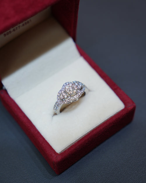Exquisite diamond ring in 14K white gold displayed in a red velvet ring box. Diamond Rings at Punjab Jewellers.