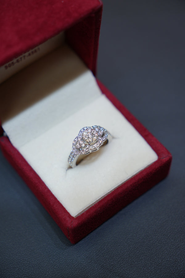 Exquisite diamond ring in 14K white gold displayed in a red velvet ring box. Diamond Rings at Punjab Jewellers.