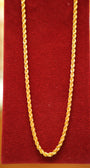 Gold chain on a red textured background