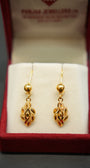 Elegant yellow gold earrings with polished finish