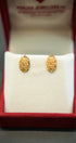 Beautiful ornamental gold earrings