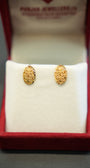 Beautiful ornamental gold earrings