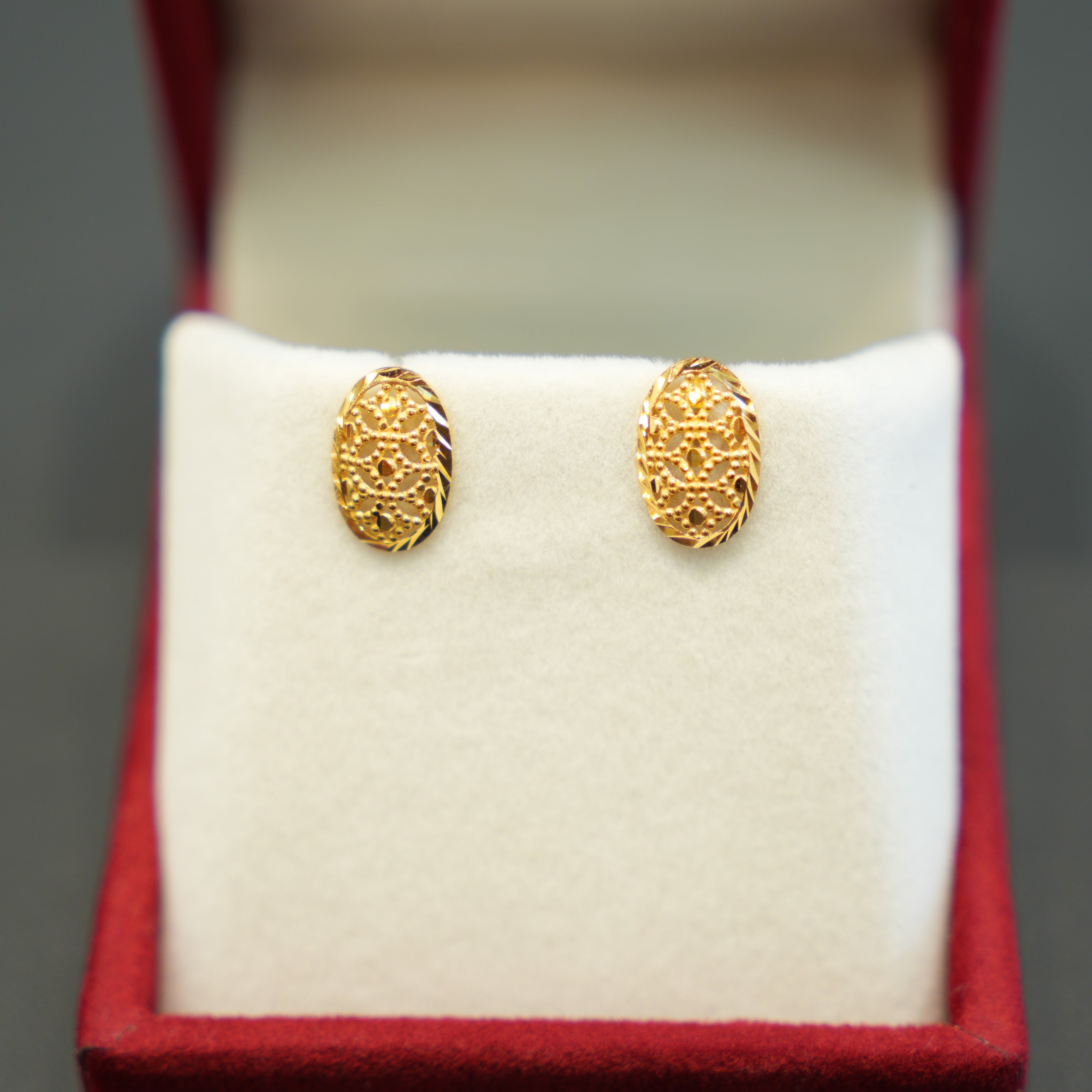 Beautiful ornamental gold earrings