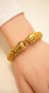 Classic gold bangle with intricate detailing