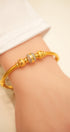 Gold bracelet with detailed craftsmanship