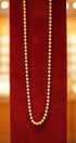 Beautiful gold chain on red velvet stand