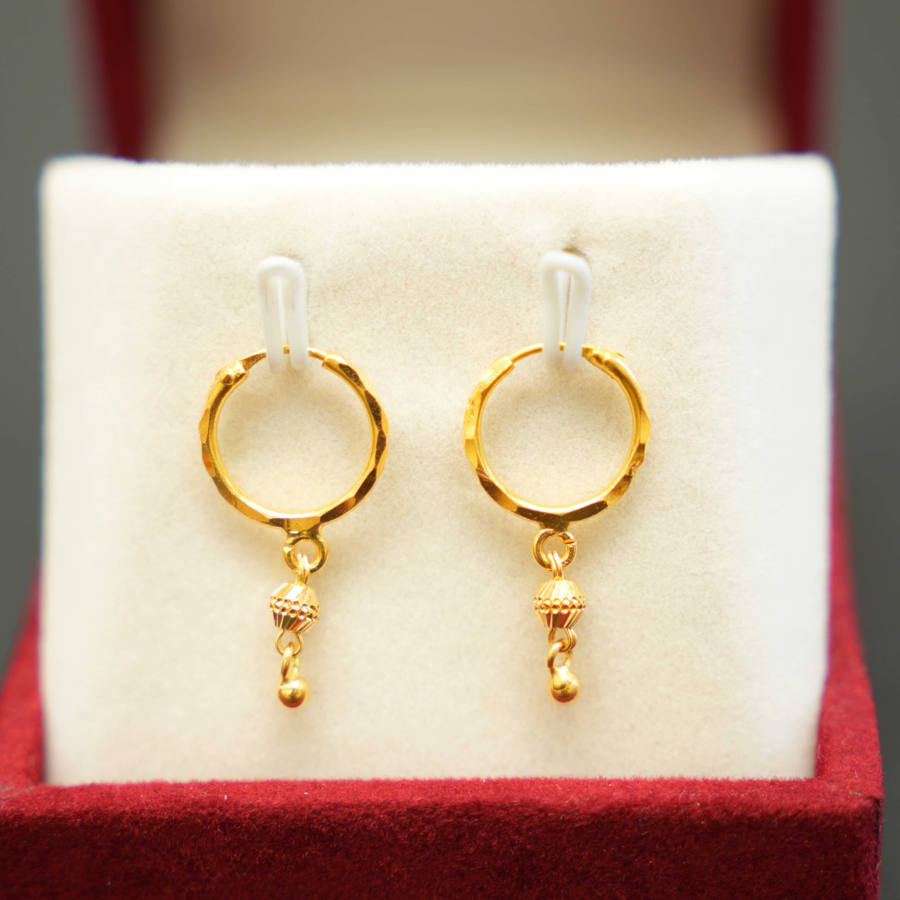 22K gold hoop earrings with a luxurious finish
