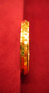Gold ring on a red background
