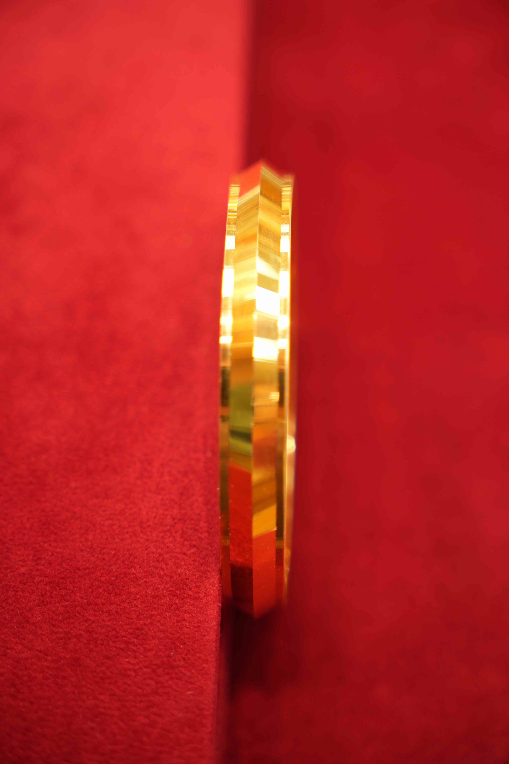 Gold ring on a red background