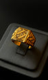 Ornate gold ring on display box