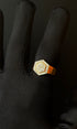 Heavy gold ring with intricate detailing