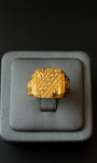 Handmade gold ring with detailed texture