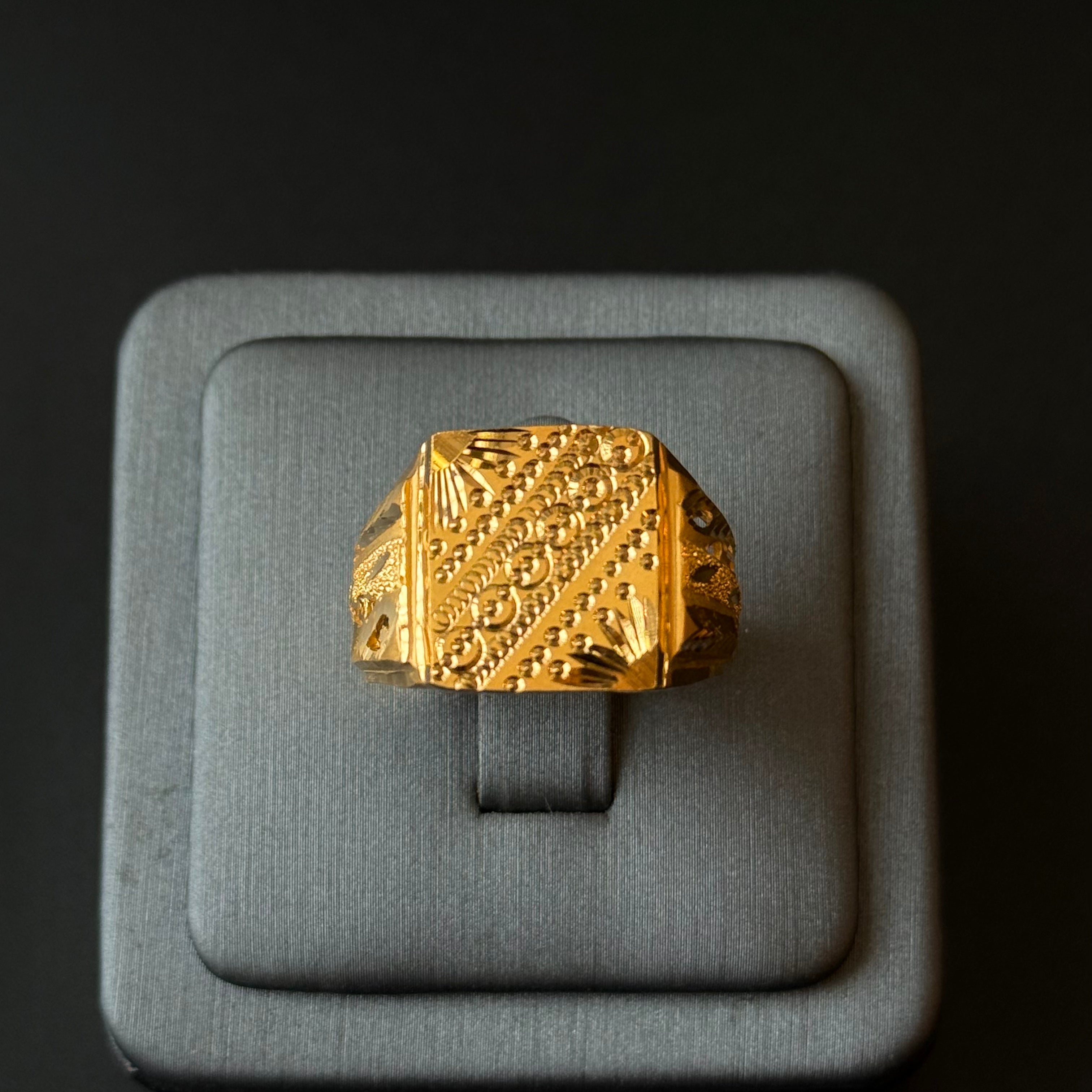Handmade gold ring with detailed texture