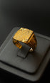 Bold gold ring with engraved centerpiece