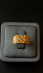 Traditional gold ring with geometric pattern