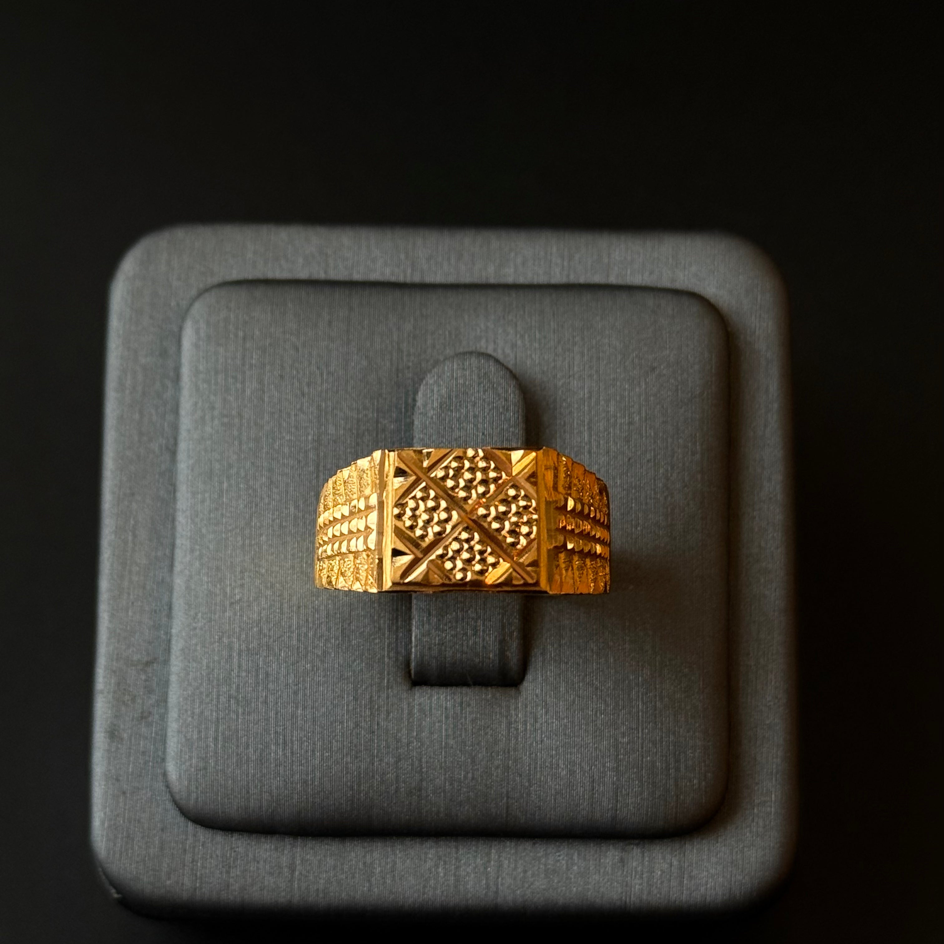 Traditional gold ring with geometric pattern