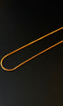 Gold chain on a black background
