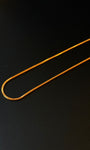 Gold chain on a black background