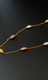 Necklace with beads on a black background