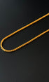 Gold chain on a black background