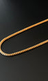 Gold chain on a black background