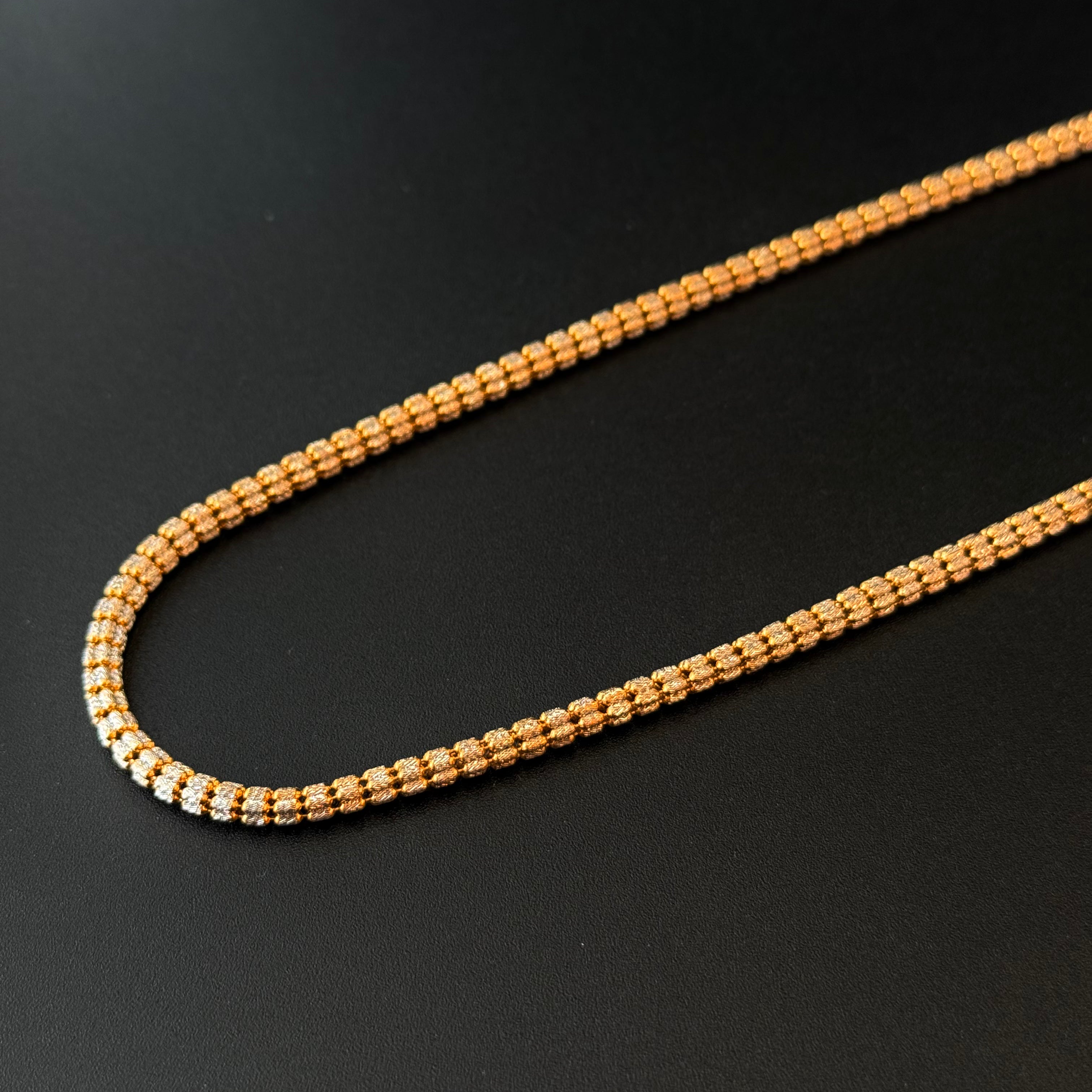 Gold chain on a black background