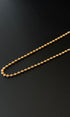 Gold chain on a black background