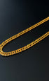 Gold chain on a black background
