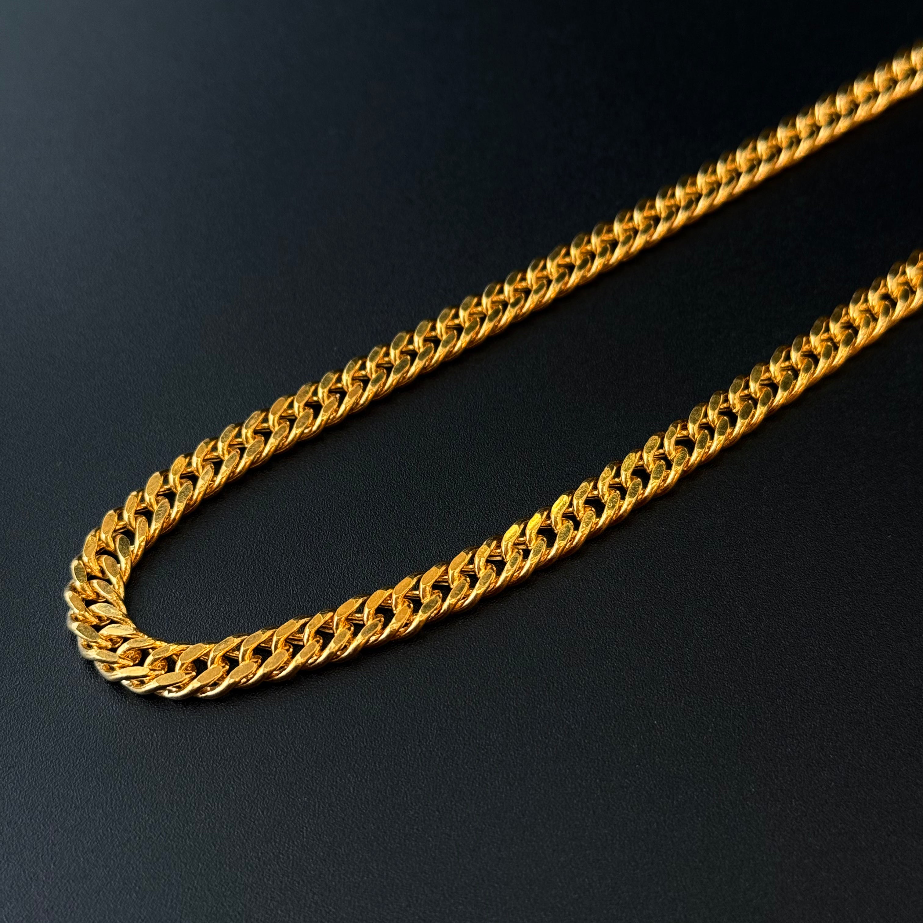 Gold chain on a black background