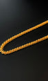 Gold chain on a black background